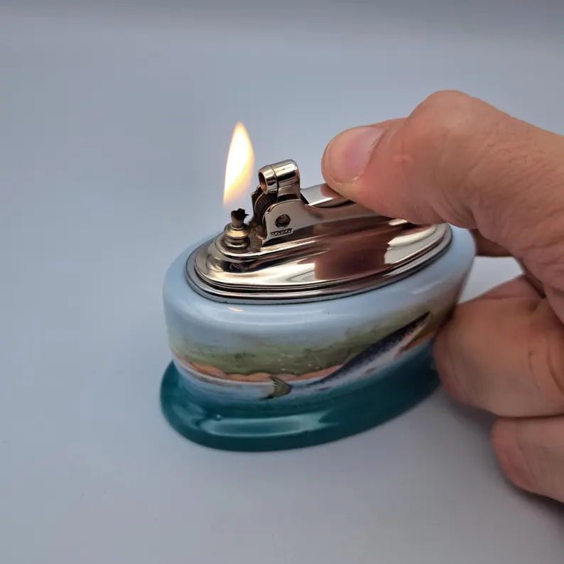 Ronson Minton Table Lighter lit and burning, held in the hand after rebuild.
